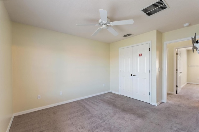 unfurnished bedroom with visible vents, baseboards, and carpet floors