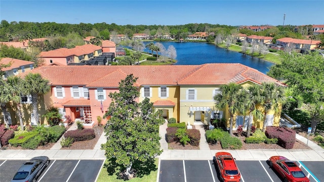 bird's eye view with a residential view and a water view