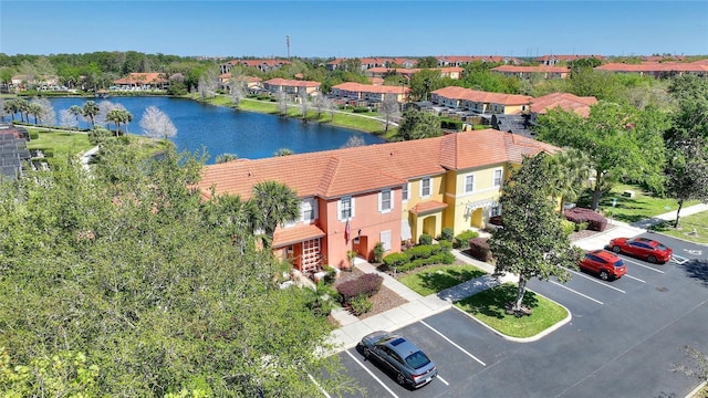 bird's eye view featuring a residential view and a water view