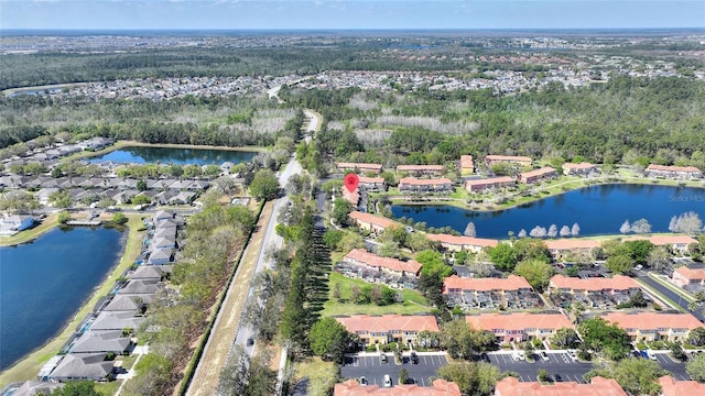 bird's eye view featuring a water view and a residential view