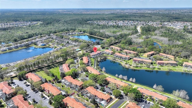 bird's eye view with a residential view and a water view