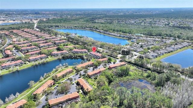 bird's eye view featuring a residential view and a water view