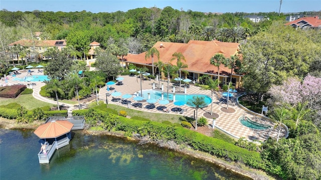 birds eye view of property with a water view