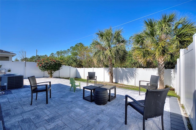 view of patio / terrace featuring central AC unit and a fenced backyard