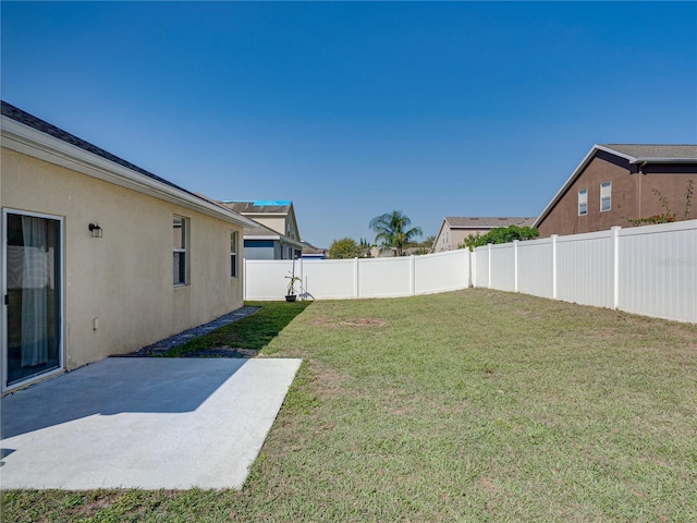 view of yard with a patio and a fenced backyard