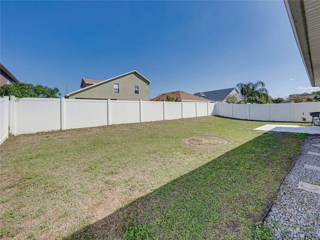 view of yard with a fenced backyard