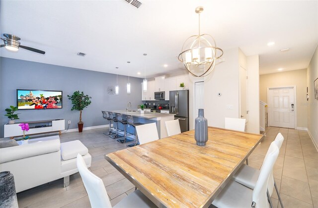 dining room with visible vents, recessed lighting, ceiling fan with notable chandelier, and baseboards