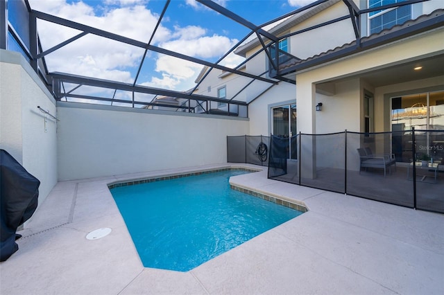 view of pool featuring a lanai, a patio area, and a fenced in pool