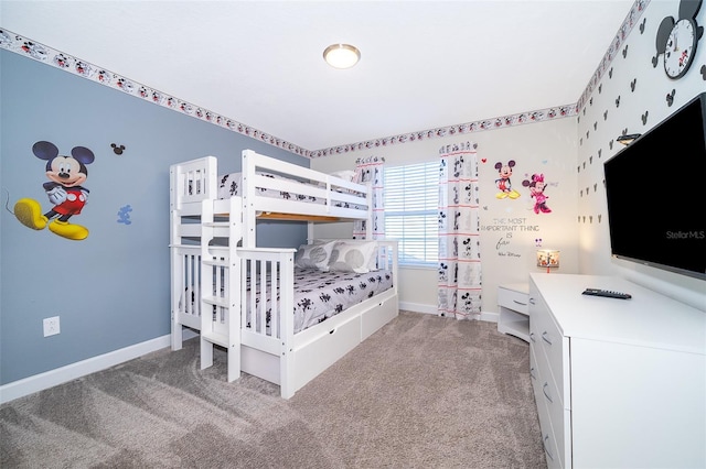 carpeted bedroom featuring baseboards