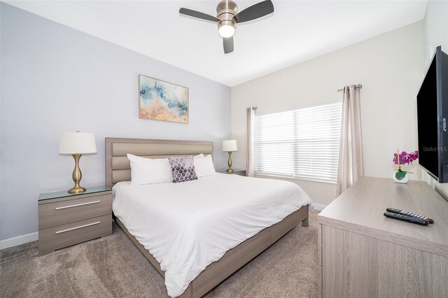 bedroom with baseboards, ceiling fan, and carpet flooring