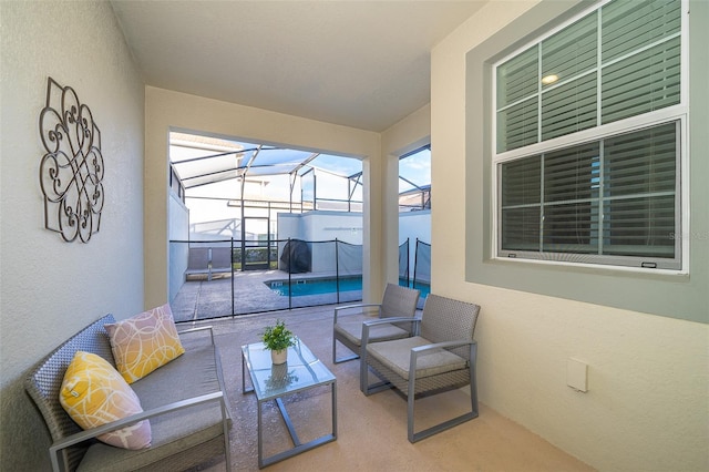 exterior space with an outdoor living space, glass enclosure, and an outdoor pool