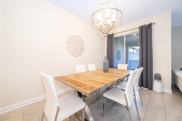 dining space with light tile patterned floors, baseboards, and a notable chandelier
