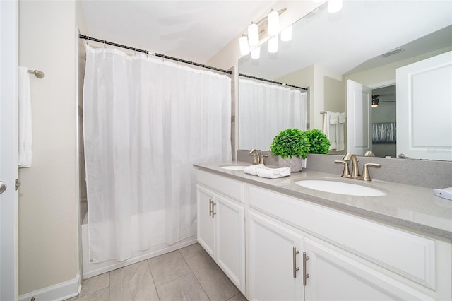 bathroom featuring a sink, visible vents, shower / tub combo with curtain, and double vanity