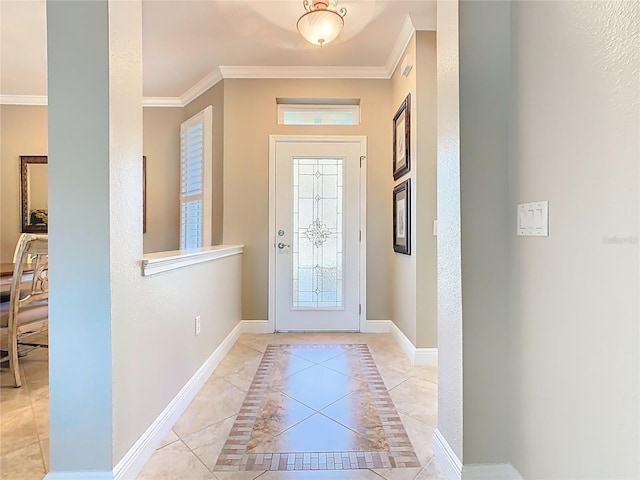 entrance foyer with baseboards and ornamental molding