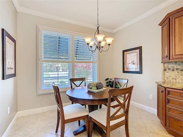 dining room featuring a chandelier, light tile patterned floors, crown molding, and baseboards