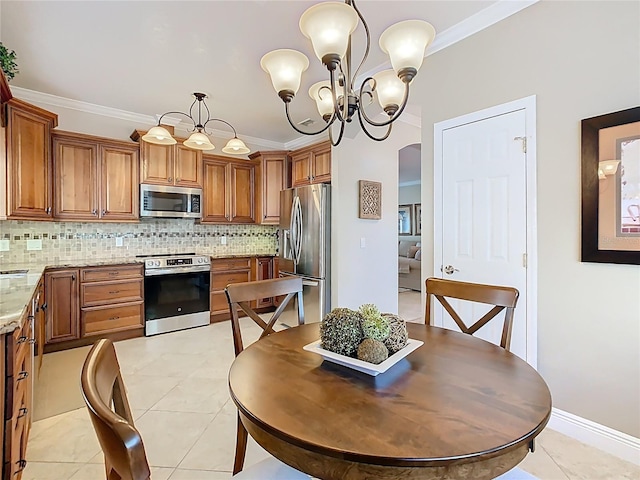 dining room featuring light tile patterned flooring, a chandelier, and crown molding