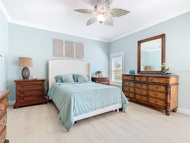 bedroom with ceiling fan, baseboards, light wood-type flooring, and ornamental molding