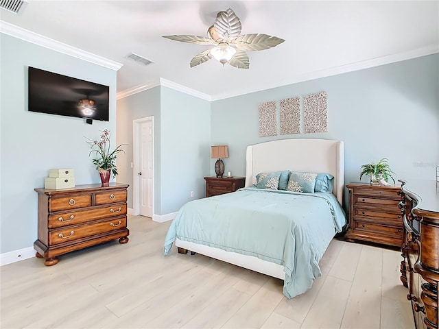 bedroom with crown molding, baseboards, visible vents, and light wood-type flooring