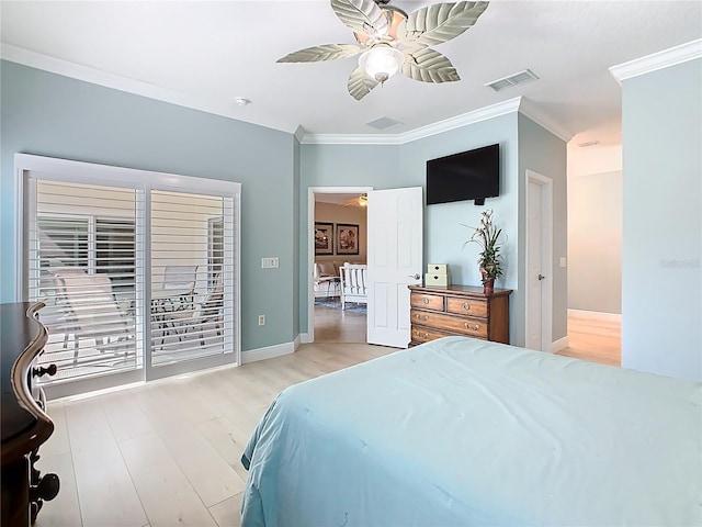 bedroom with visible vents, ornamental molding, a ceiling fan, wood finished floors, and baseboards