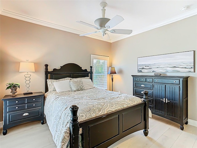 bedroom with baseboards, ceiling fan, and crown molding