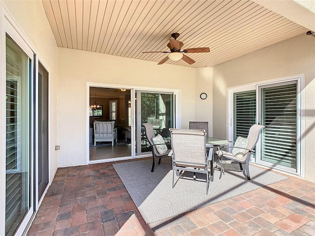 view of patio / terrace featuring outdoor dining space and a ceiling fan