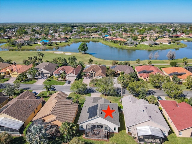 birds eye view of property featuring a residential view and a water view