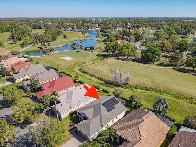 aerial view featuring a residential view, view of golf course, and a water view