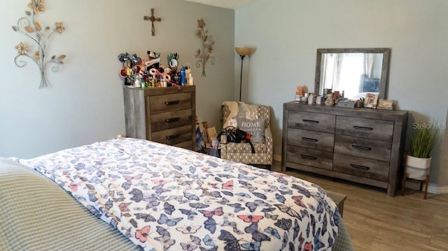 bedroom featuring wood finished floors