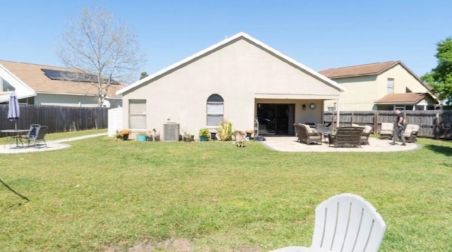 back of house with a yard, fence, cooling unit, and a patio area