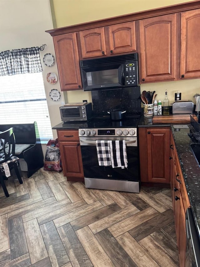kitchen featuring black microwave and stainless steel range with electric stovetop
