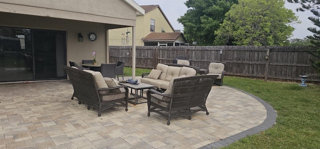 view of patio / terrace with fence and an outdoor hangout area