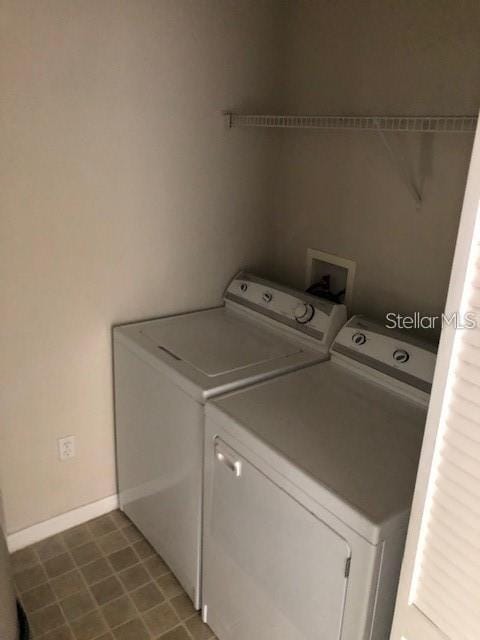 9061 Lee Vista Blvd Unit 1303, Orlando, FL 32829 - washroom featuring separate washer and dryer and baseboards