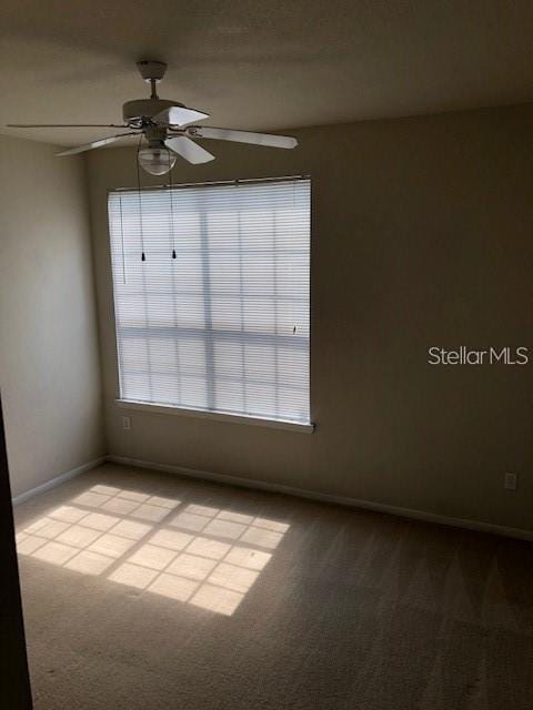 9061 Lee Vista Blvd Unit 1303, Orlando, FL 32829 - spare room with a ceiling fan, light colored carpet, plenty of natural light, and baseboards