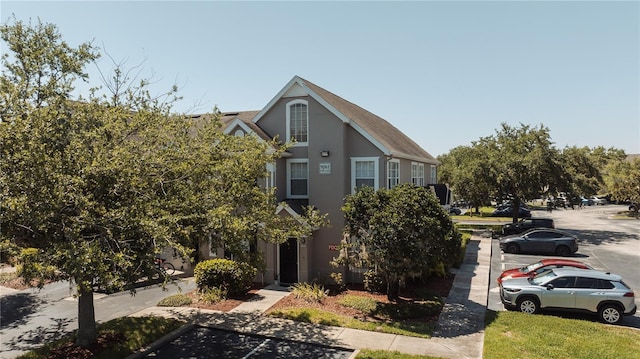 9061 Lee Vista Blvd Unit 1303, Orlando, FL 32829 - townhome / multi-family property with uncovered parking and stucco siding