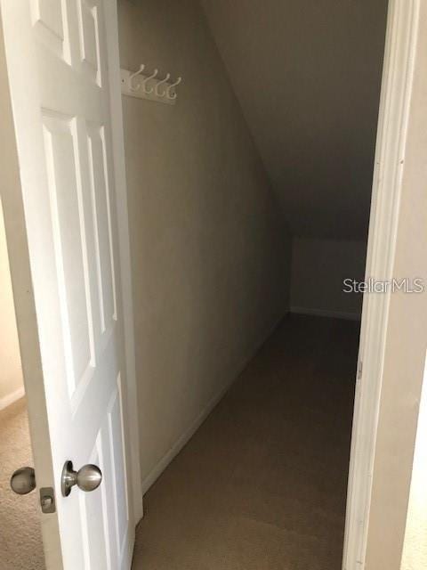 9061 Lee Vista Blvd Unit 1303, Orlando, FL 32829 - additional living space with dark colored carpet and baseboards