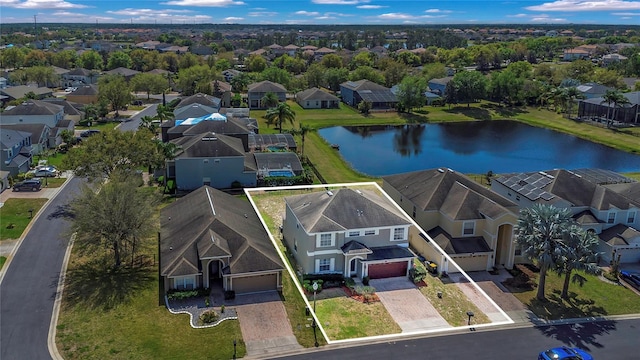 bird's eye view featuring a residential view and a water view