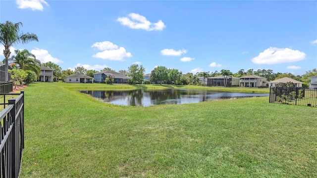 view of water feature with fence and a residential view