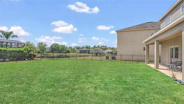 view of yard with a patio area and a fenced backyard