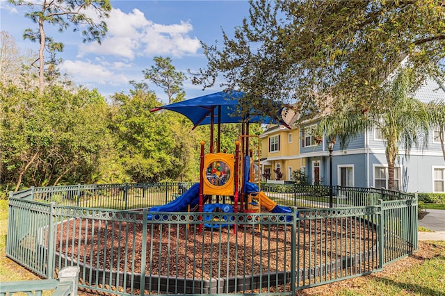 communal playground featuring fence