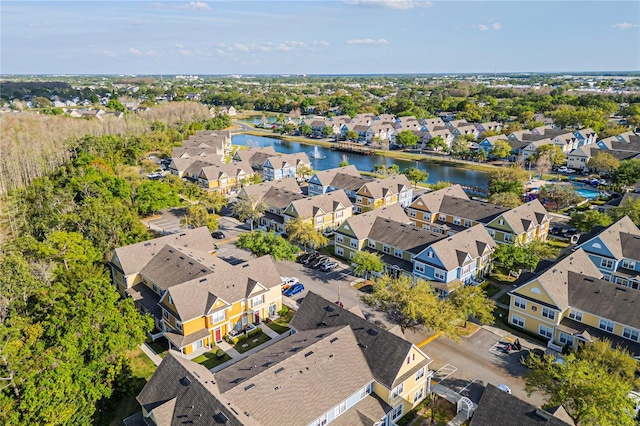 birds eye view of property featuring a residential view and a water view