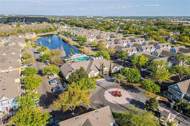 drone / aerial view with a residential view and a water view