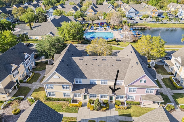 bird's eye view with a residential view and a water view