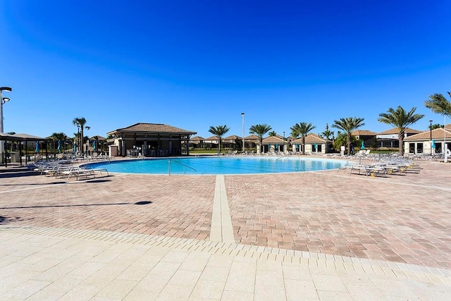 1432 Rolling Fairway Dr, Davenport, FL 33896 - community pool featuring a patio area