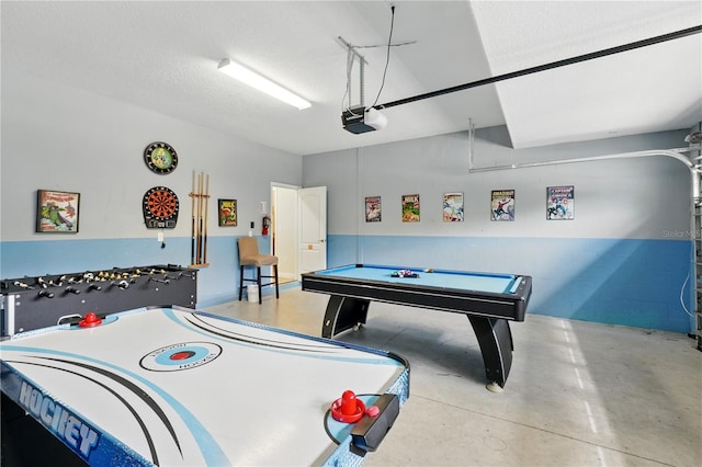 1432 Rolling Fairway Dr, Davenport, FL 33896 - recreation room featuring a textured ceiling, concrete floors, a garage, and pool table