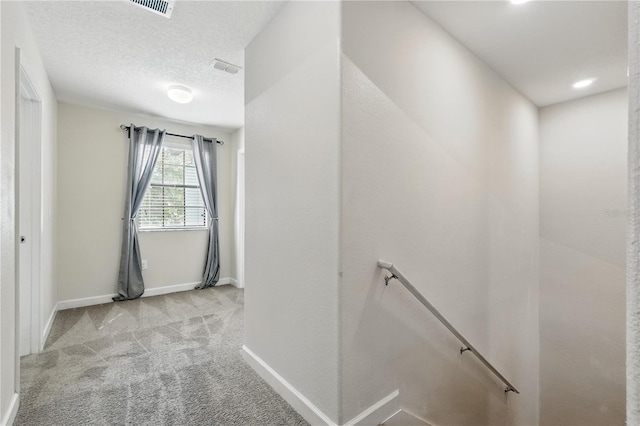 1432 Rolling Fairway Dr, Davenport, FL 33896 - hallway with baseboards, an upstairs landing, carpet, and a textured ceiling