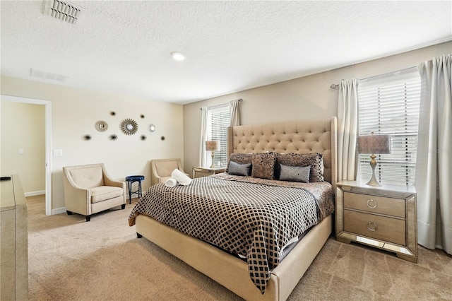 1432 Rolling Fairway Dr, Davenport, FL 33896 - bedroom featuring light carpet, baseboards, visible vents, and a textured ceiling