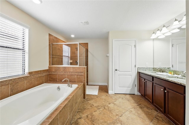 1432 Rolling Fairway Dr, Davenport, FL 33896 - full bathroom featuring a garden tub, a sink, a stall shower, double vanity, and baseboards