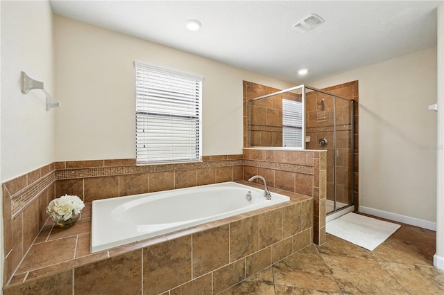 1432 Rolling Fairway Dr, Davenport, FL 33896 - bathroom with visible vents, a bath, a shower stall, recessed lighting, and stone finish flooring