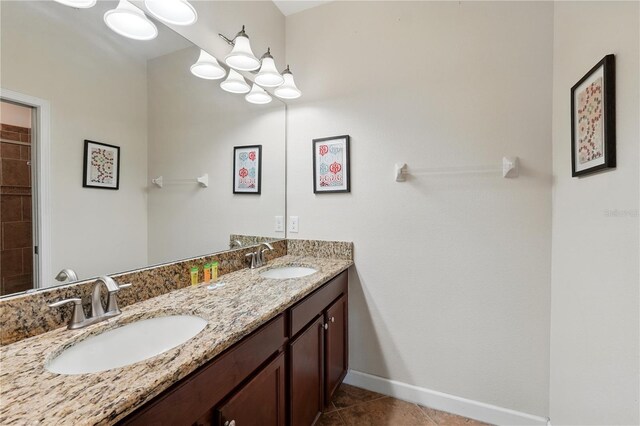 1432 Rolling Fairway Dr, Davenport, FL 33896 - bathroom featuring a chandelier, tile patterned floors, a sink, and baseboards