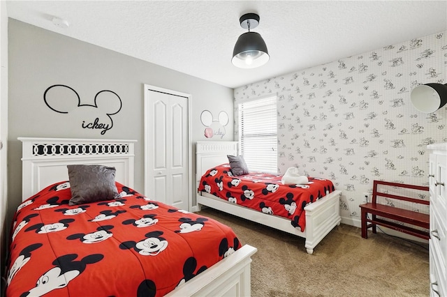 1432 Rolling Fairway Dr, Davenport, FL 33896 - carpeted bedroom with a closet, baseboards, a textured ceiling, and wallpapered walls